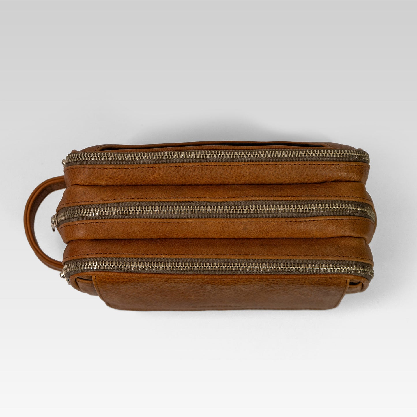 Neceser Marco en piel de bisonte café miel